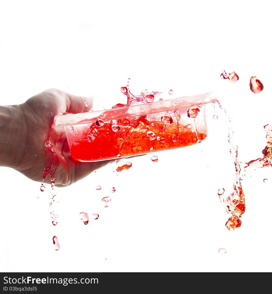 Splashing red water from a bowl