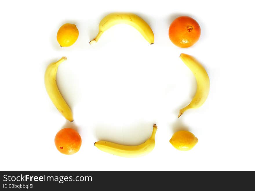 Lemon, bananas, orange photo frame isolated on white