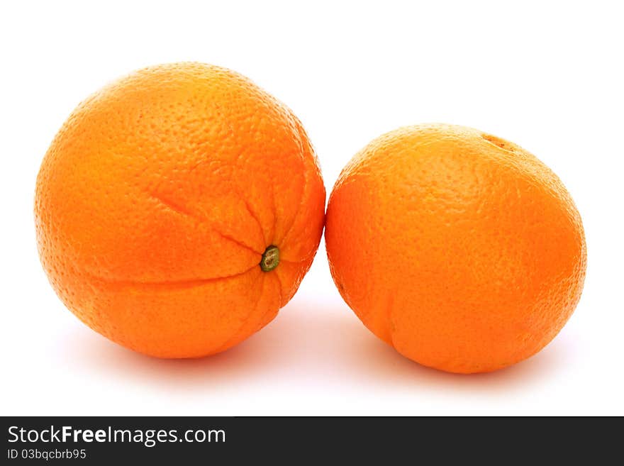 Two fresh oranges isolated on white background