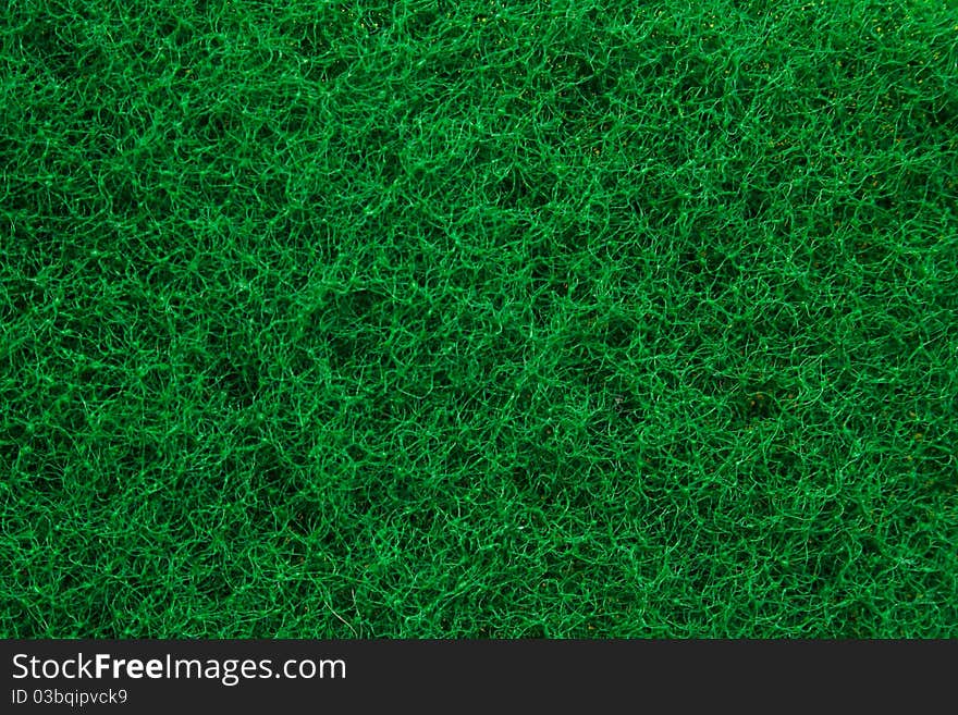 Green abrasive sponge texture background like grass