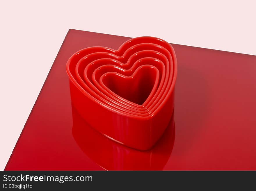 a closeup of plastic heart shaped cookie cutters