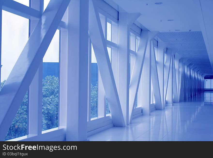 Modern business building interior with large glass facade and concrete. Modern business building interior with large glass facade and concrete