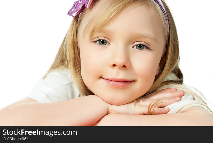 Cute little girl looks into the camera