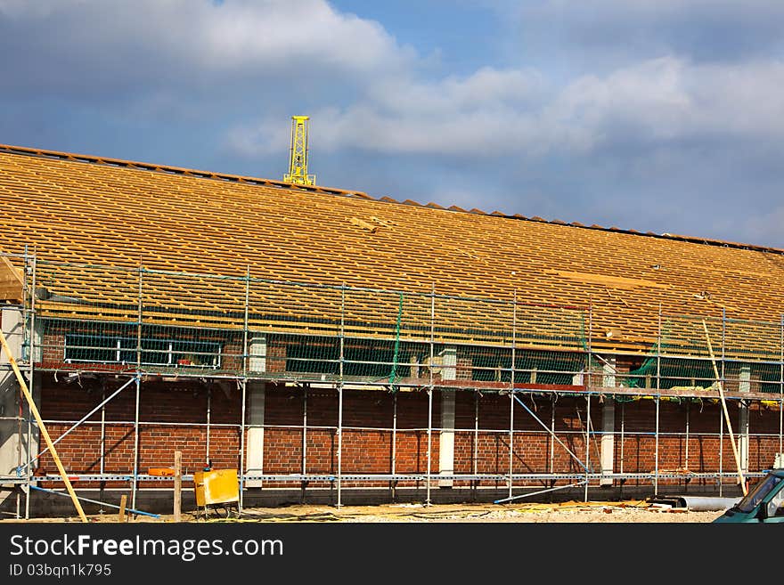 A timber framed roof on a construction site