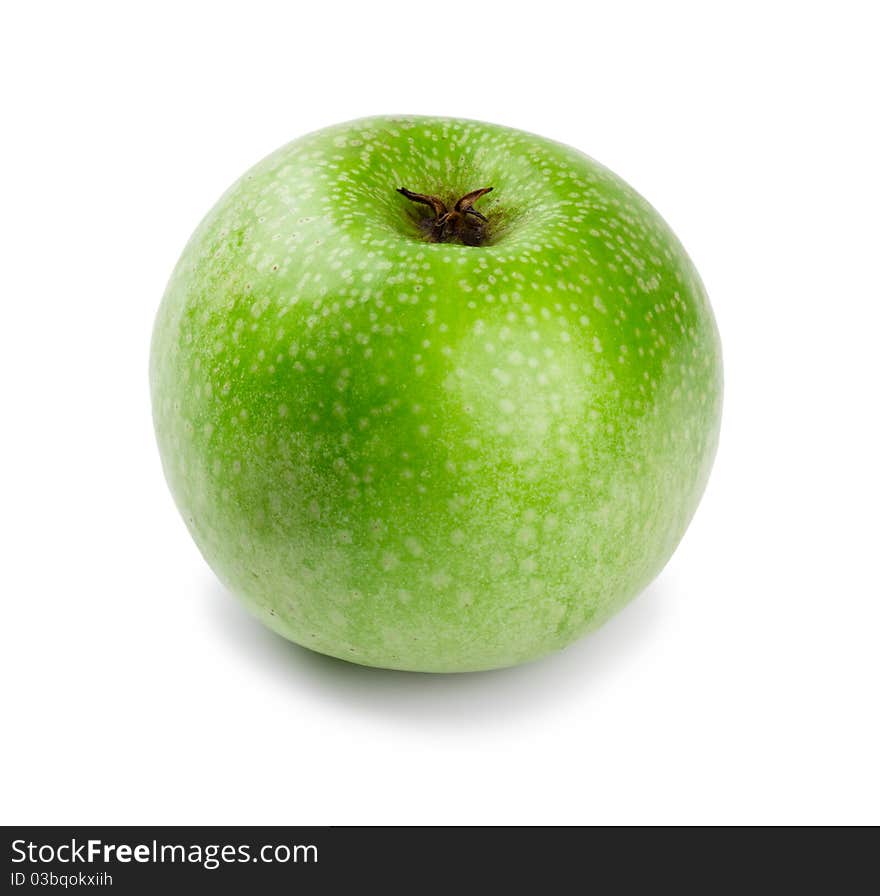 Ripe and juicy green apple a shank downwards isolated on a white background