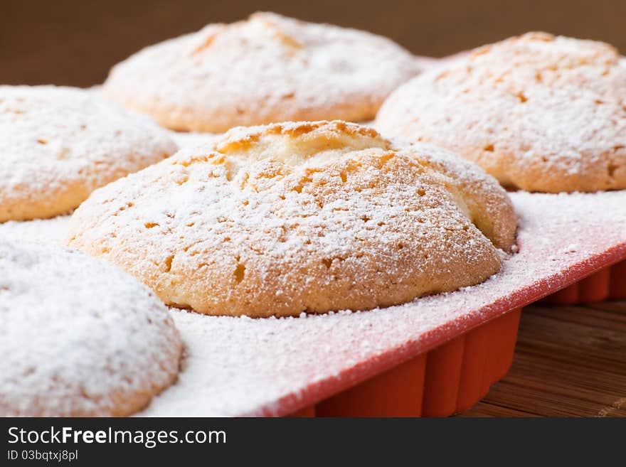 Muffins with a sugar powder in a silicon mold