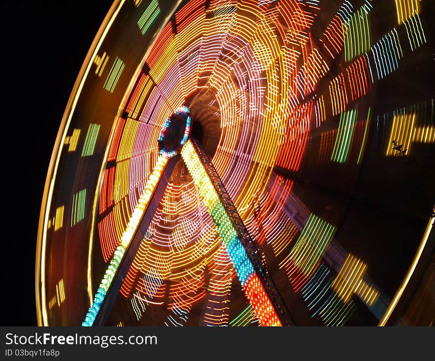 Ferries wheel spinning at night. Ferries wheel spinning at night