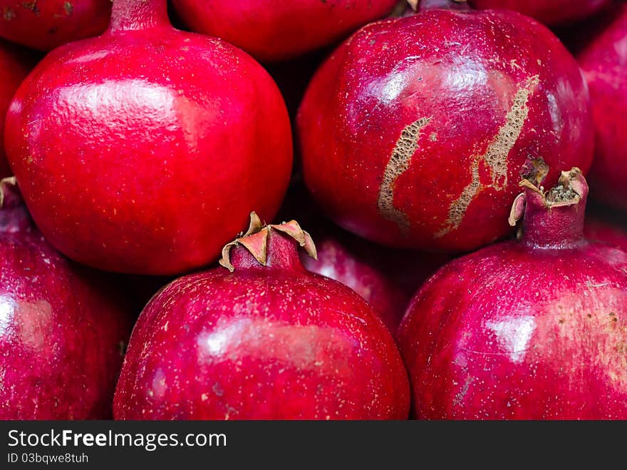 Red pomegranates at the old market of Acre in Israel