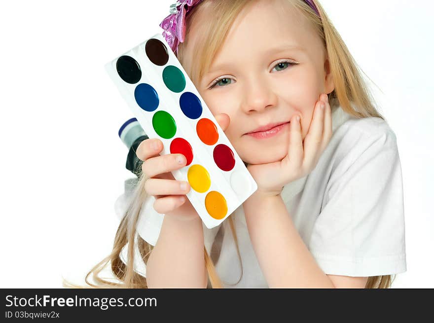 Cute little girl with paints