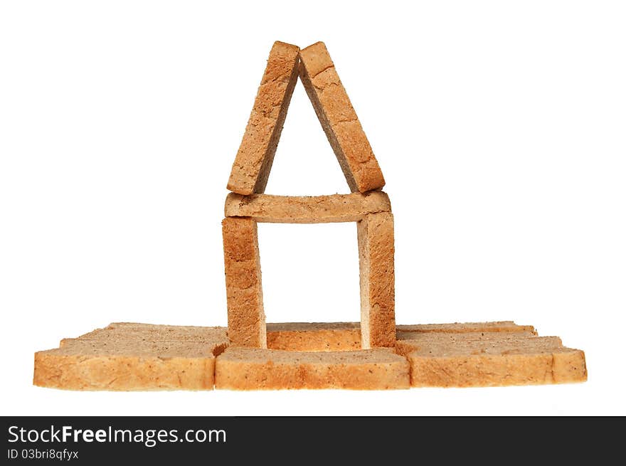 House from bread on a white background