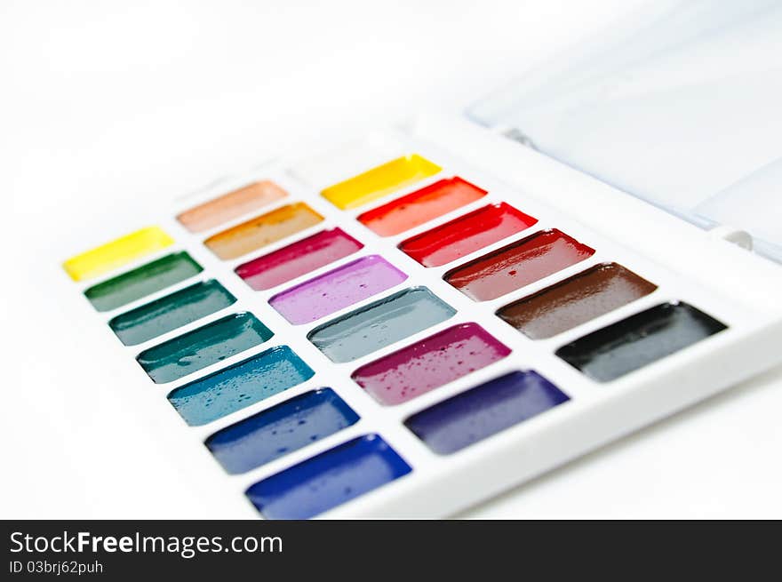 Watercolour paints on a white background
