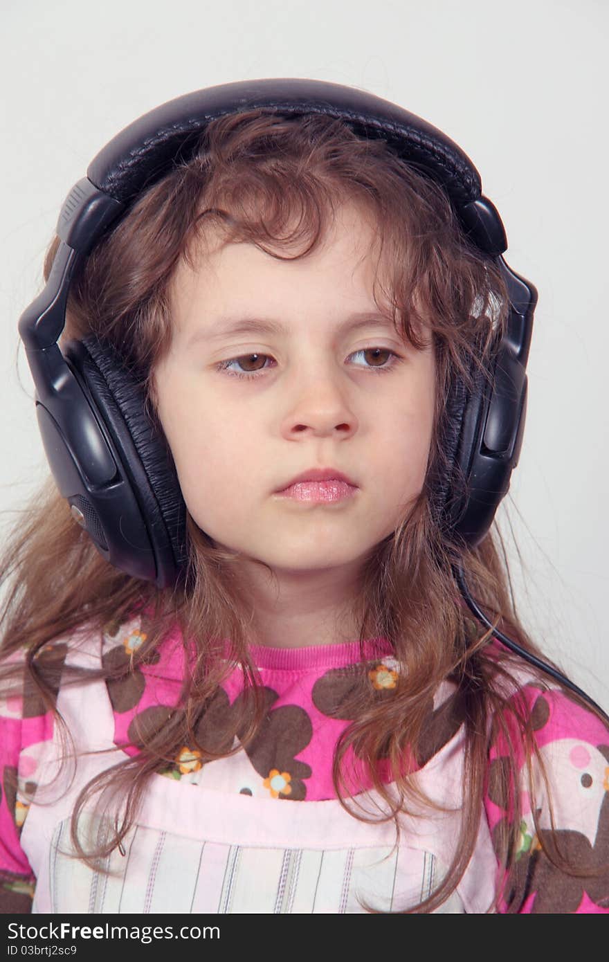 A small girl and headphones