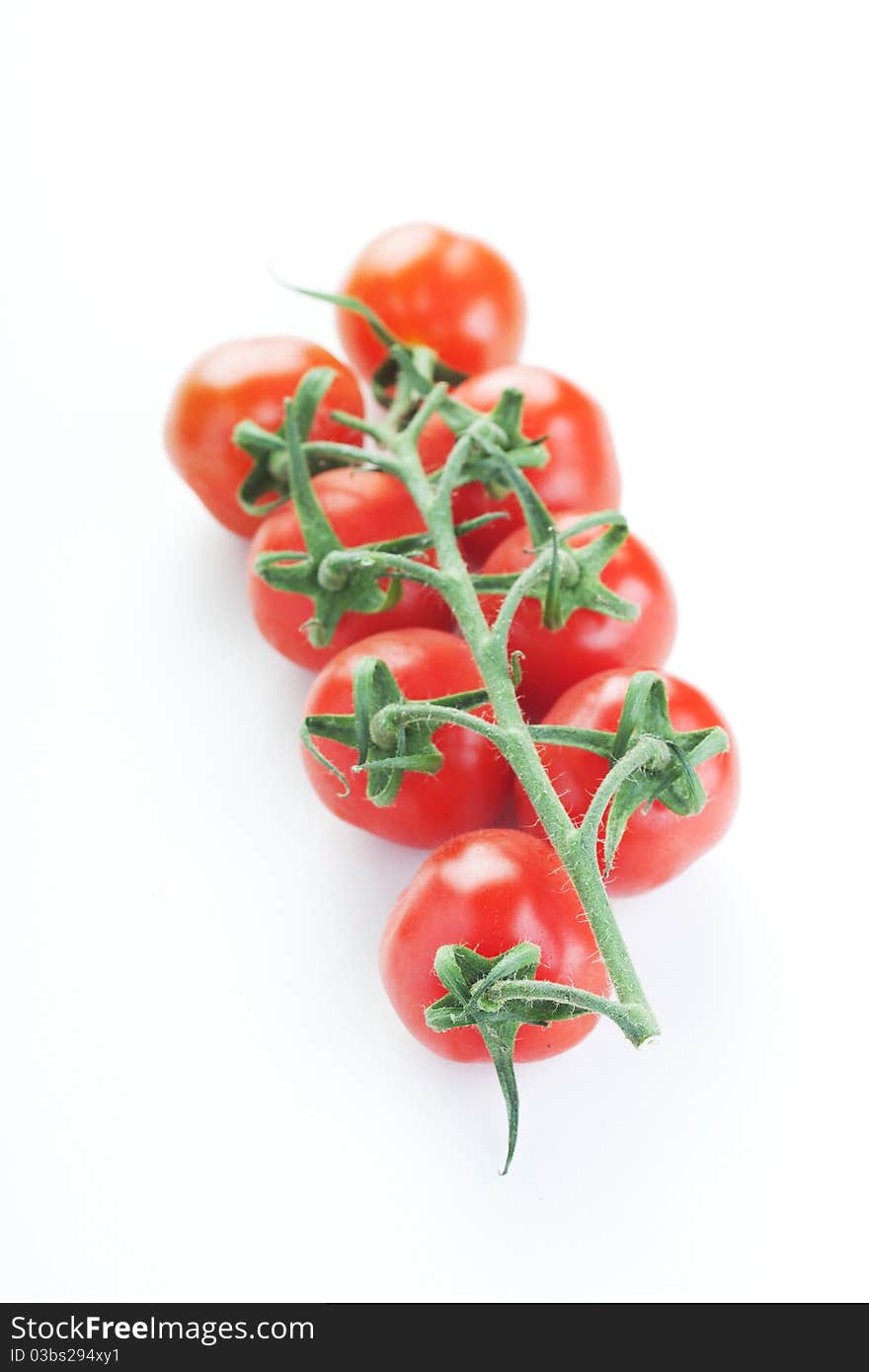 The fresh Tomatoes on a white background