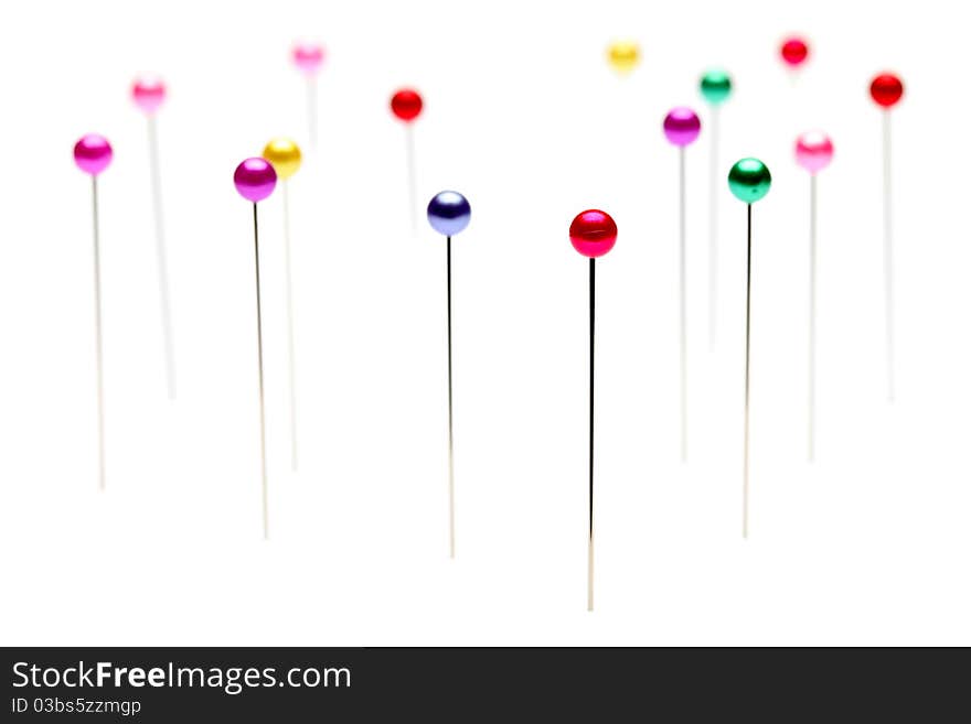 Colorful pins isolated on white background