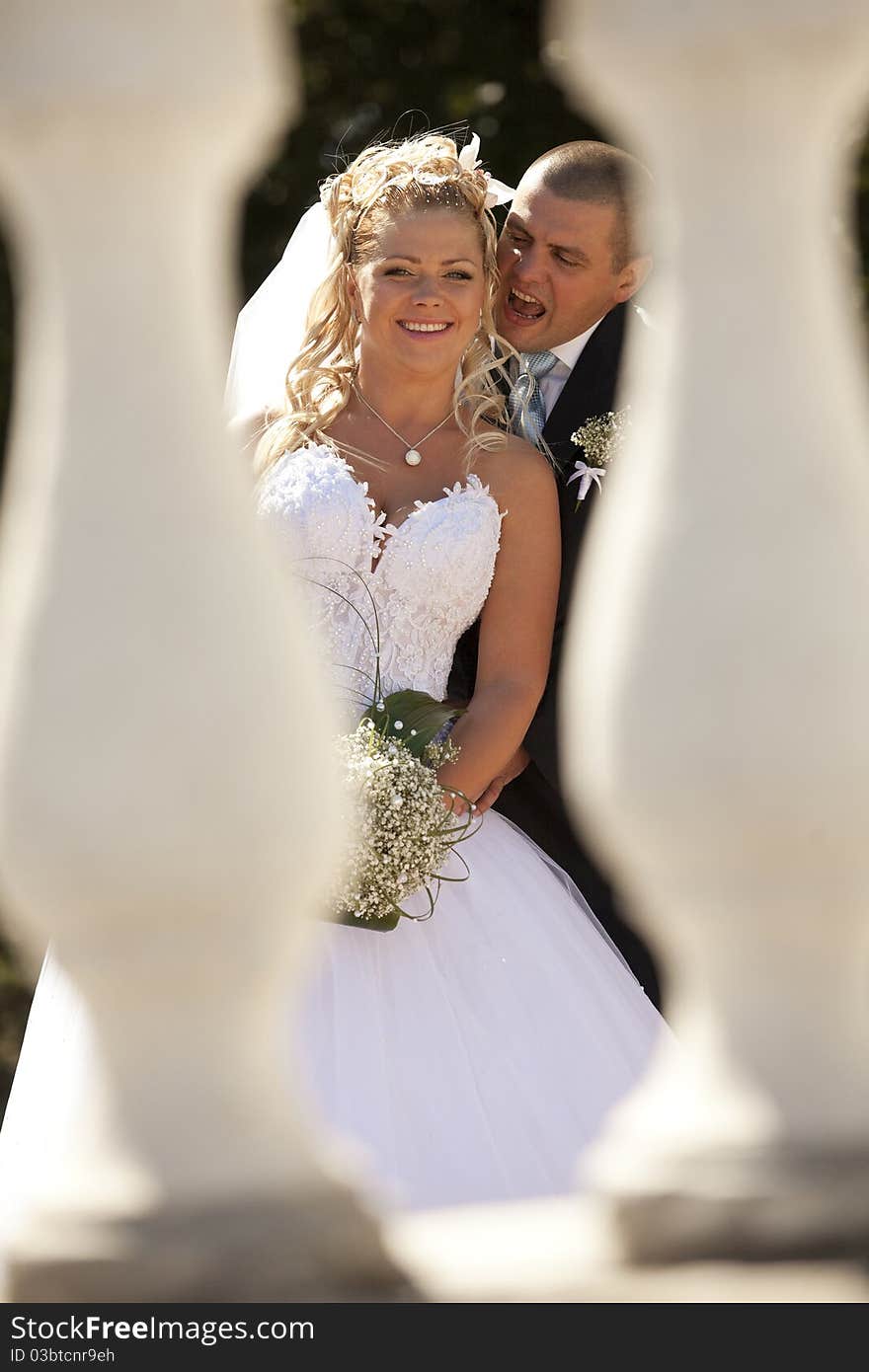 Colorful wedding shot of young bride and groom outdoor. Colorful wedding shot of young bride and groom outdoor