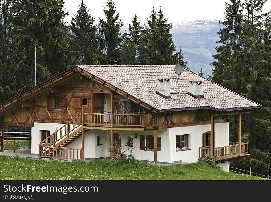 Traditional wooden House with Forest in Tyrol, Austria