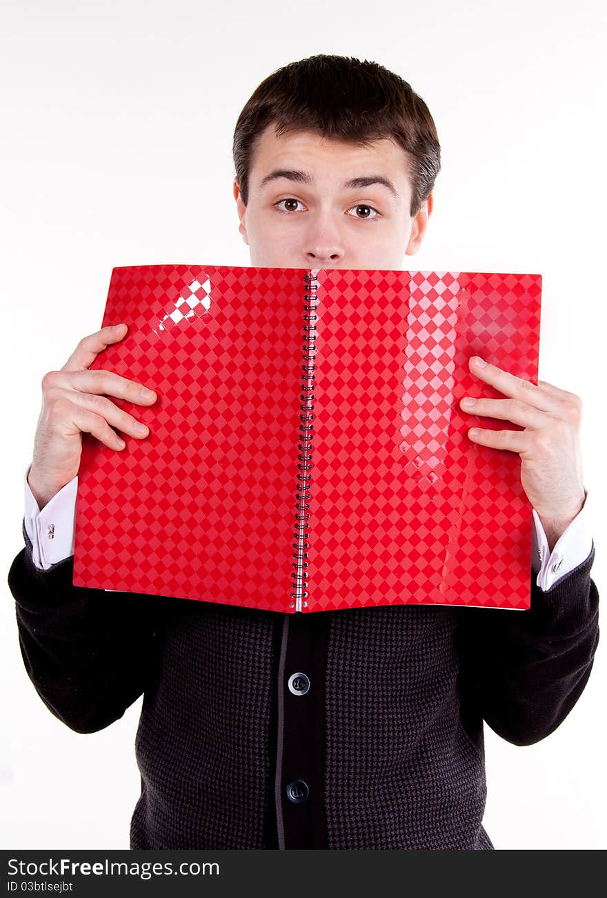 A university college student or casual man reading or studying a textbook. A university college student or casual man reading or studying a textbook.