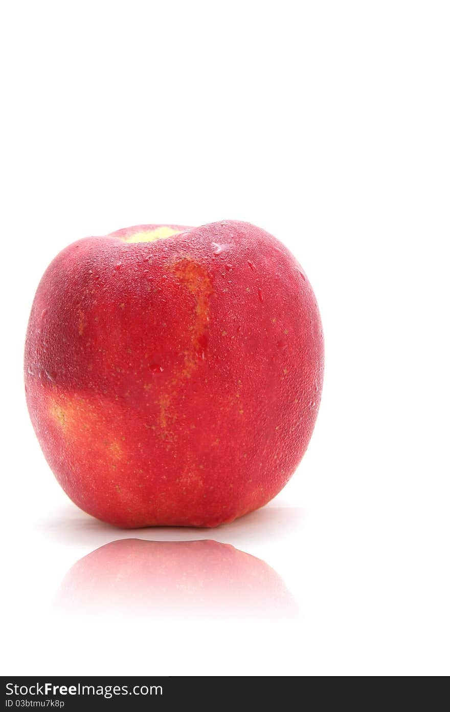 Isolated Cleaned red apple with water drops on it with reflection. Isolated Cleaned red apple with water drops on it with reflection.