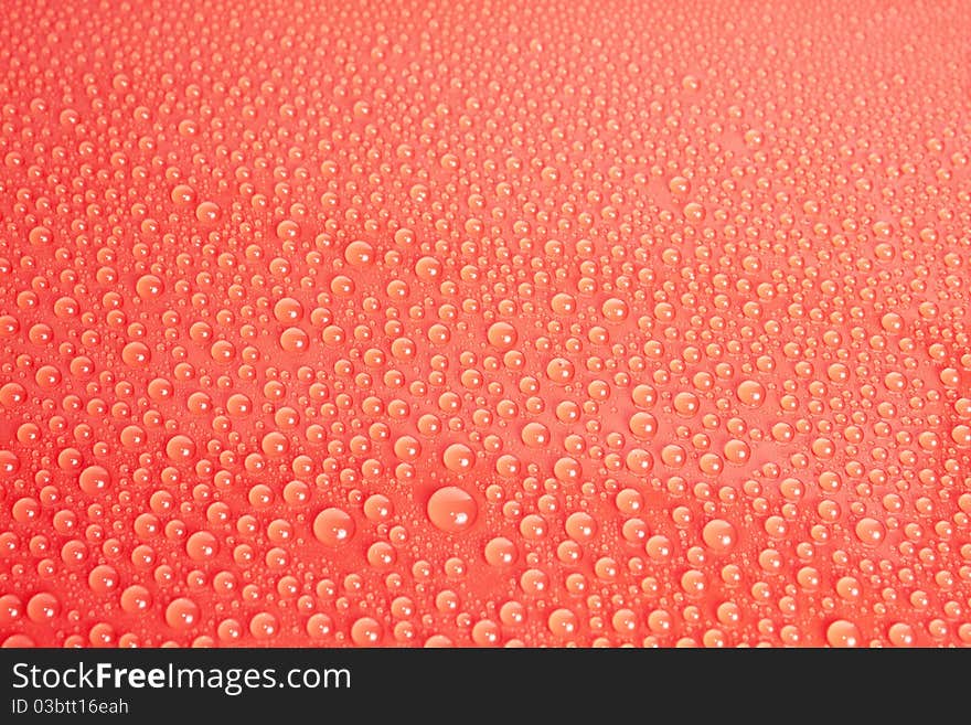 Red Water Drops Background on glass