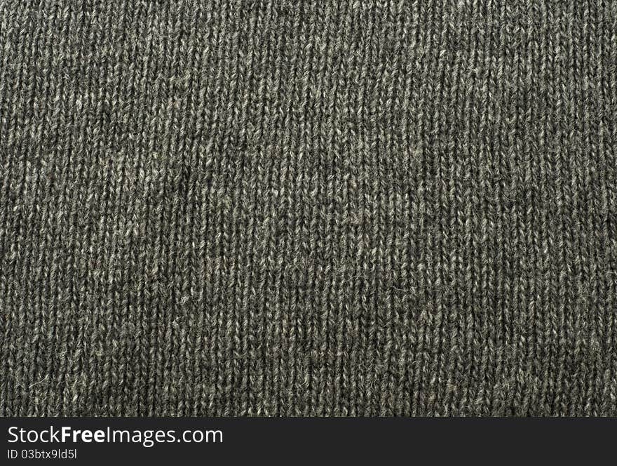 Gray wool knitted background or texture. Gray wool knitted background or texture