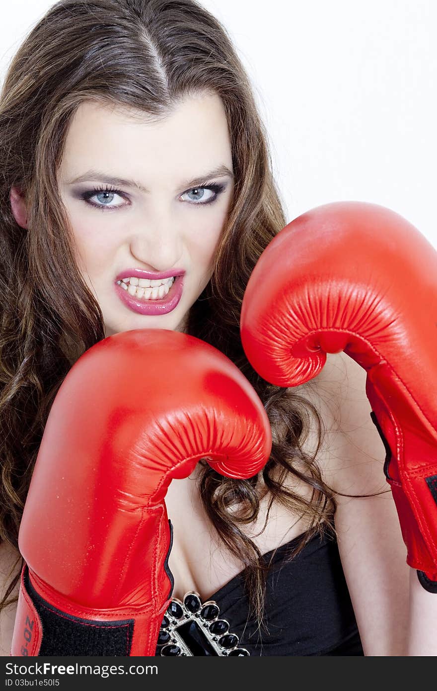 Portrait of young woman with boxing gloves