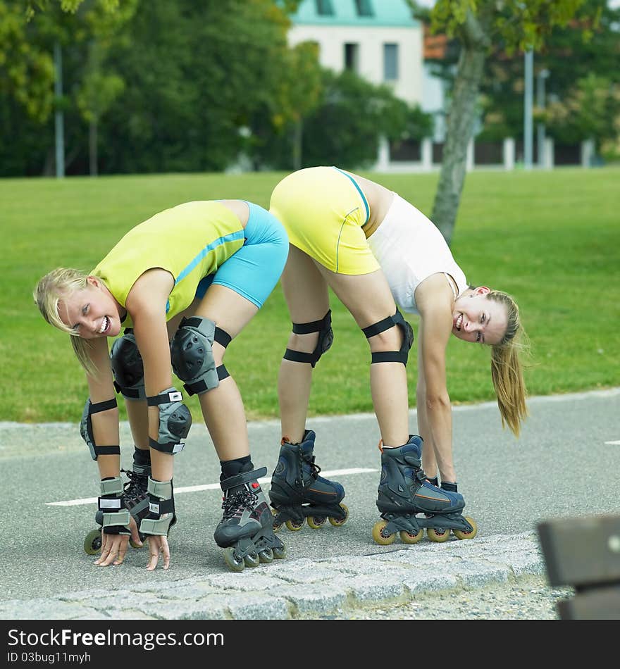 Two young woman inline skaters