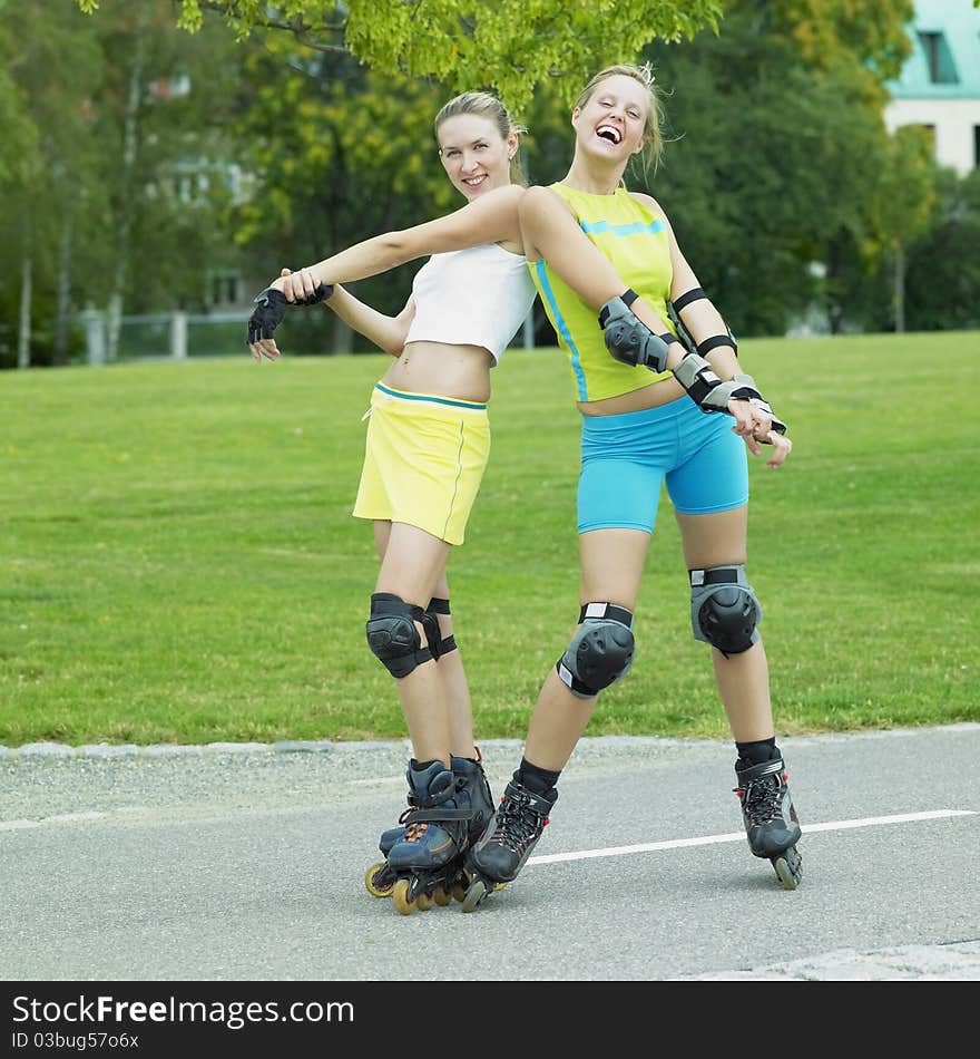 Two young woman inline skaters