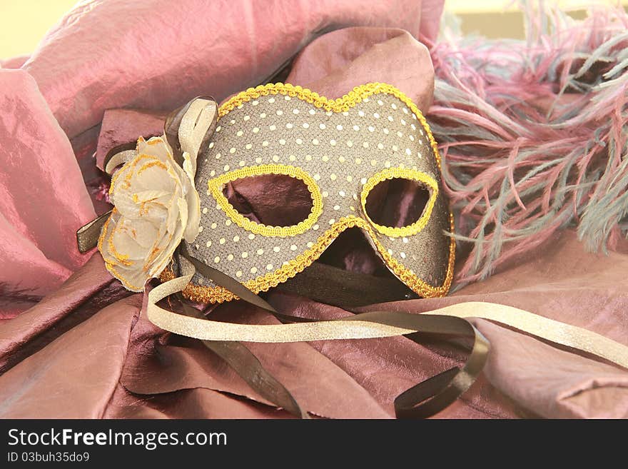 Venetian mask resting on a chair. Venetian mask resting on a chair