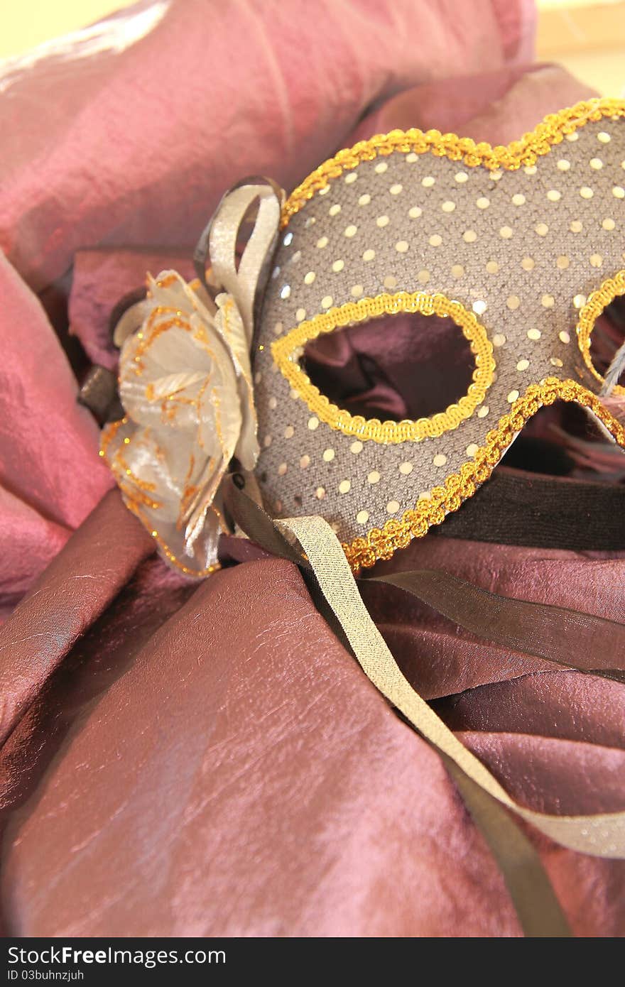 Venetian mask resting on a chair. Venetian mask resting on a chair