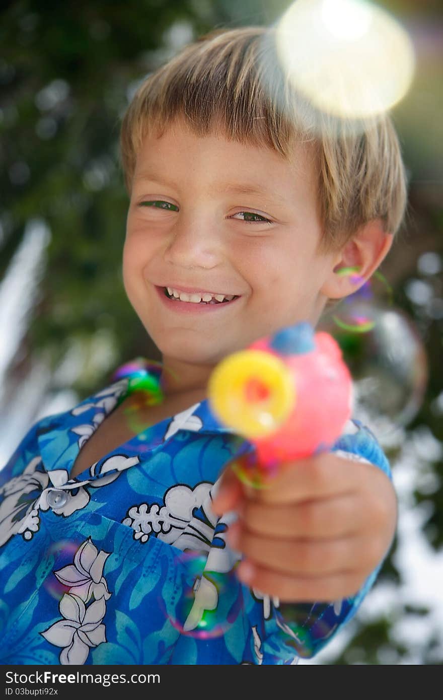 Boy Playing With Bubbles