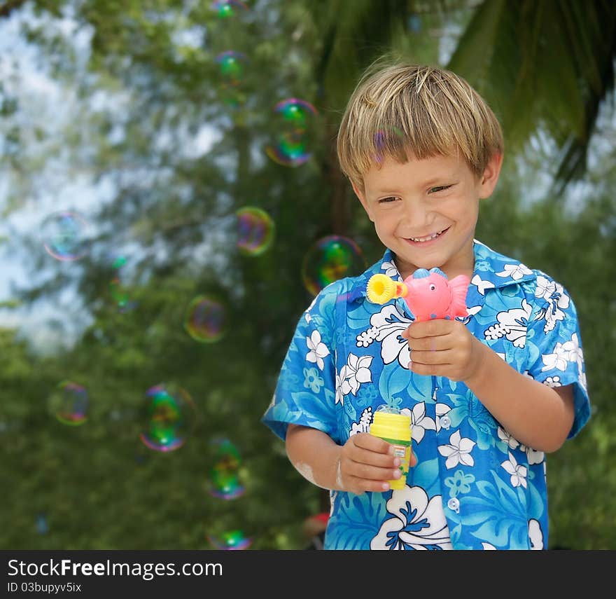 Boy playing with bubbles