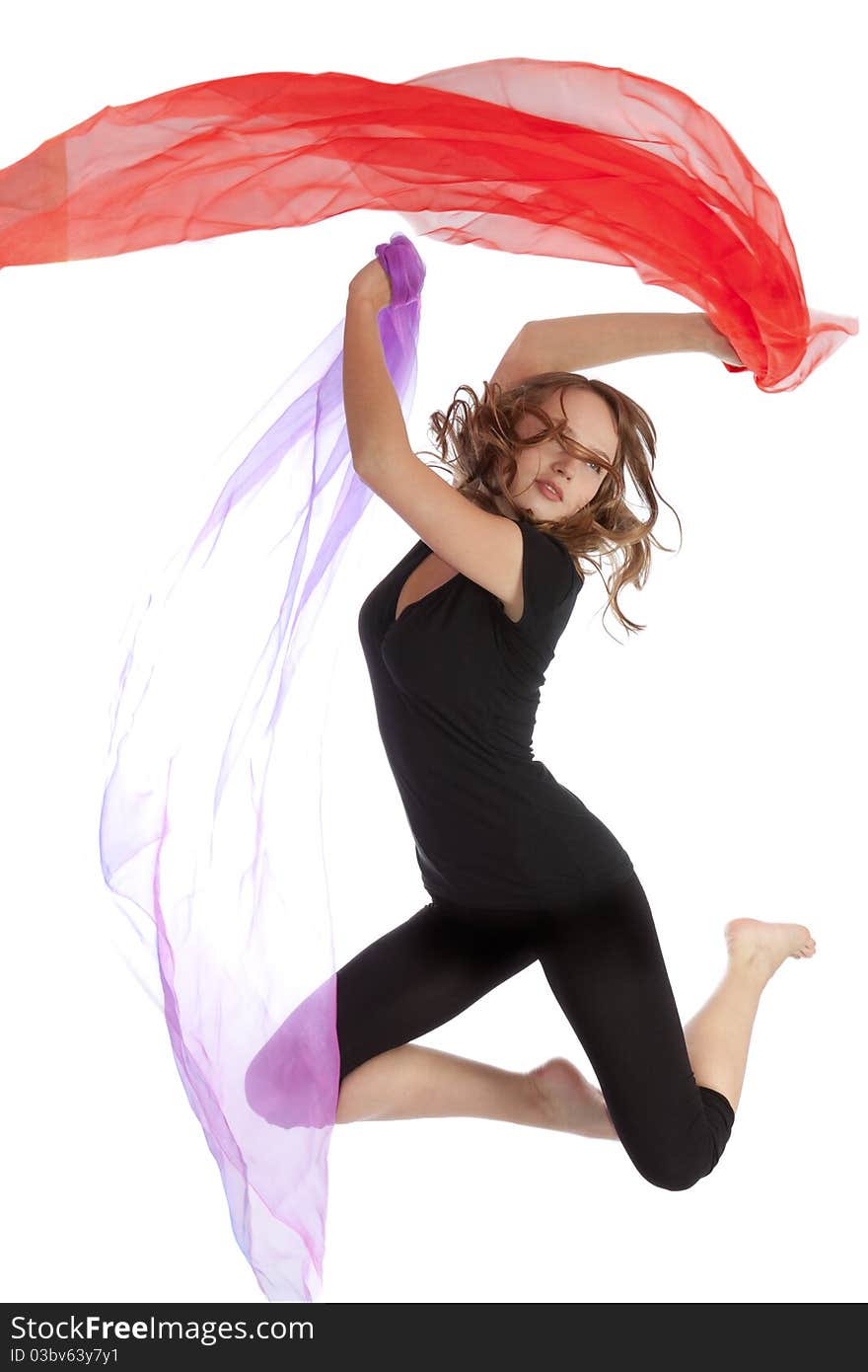 Young beautiful woman jumping on an isolated white background. Young beautiful woman jumping on an isolated white background