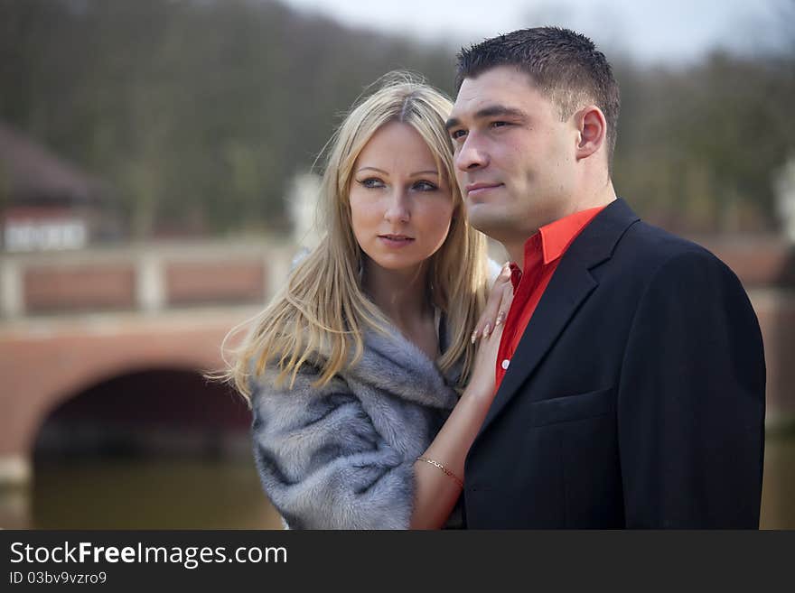 Portrait of happy young couple posing outdoor. Portrait of happy young couple posing outdoor