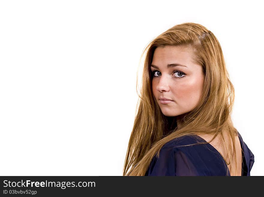 Young danish scandinavian woman with beautiful long brown hair and green/grey eyes posing in a blue dress on white studio background. Young danish scandinavian woman with beautiful long brown hair and green/grey eyes posing in a blue dress on white studio background.