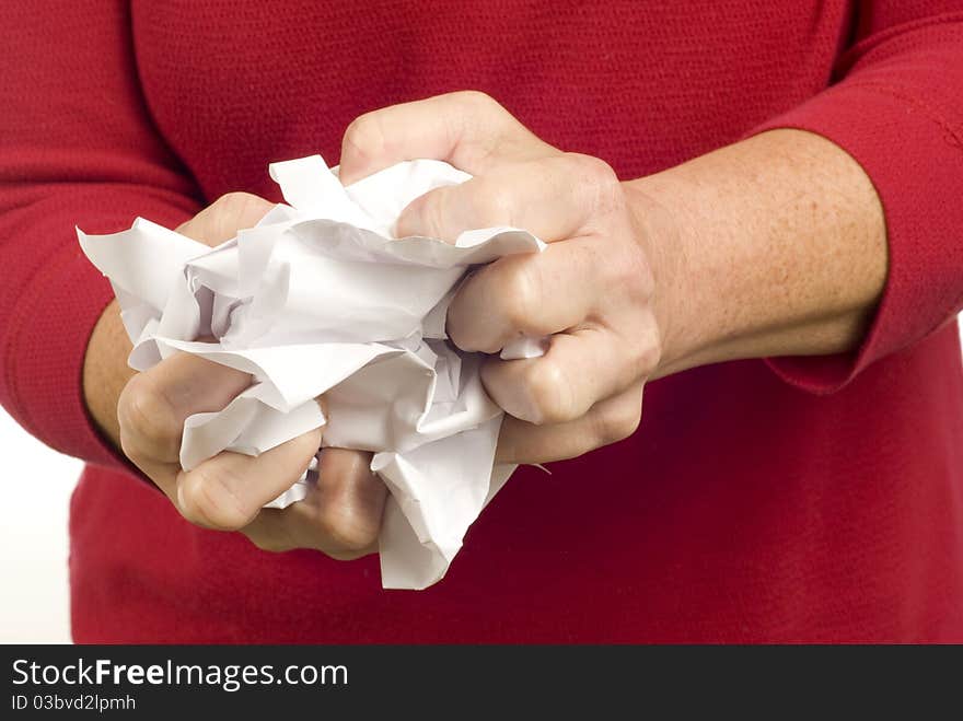 Horizontal shot of a woman having her paperwork rejected.  She is crumpling up her paper while being stressed and frustrated. Horizontal shot of a woman having her paperwork rejected.  She is crumpling up her paper while being stressed and frustrated.