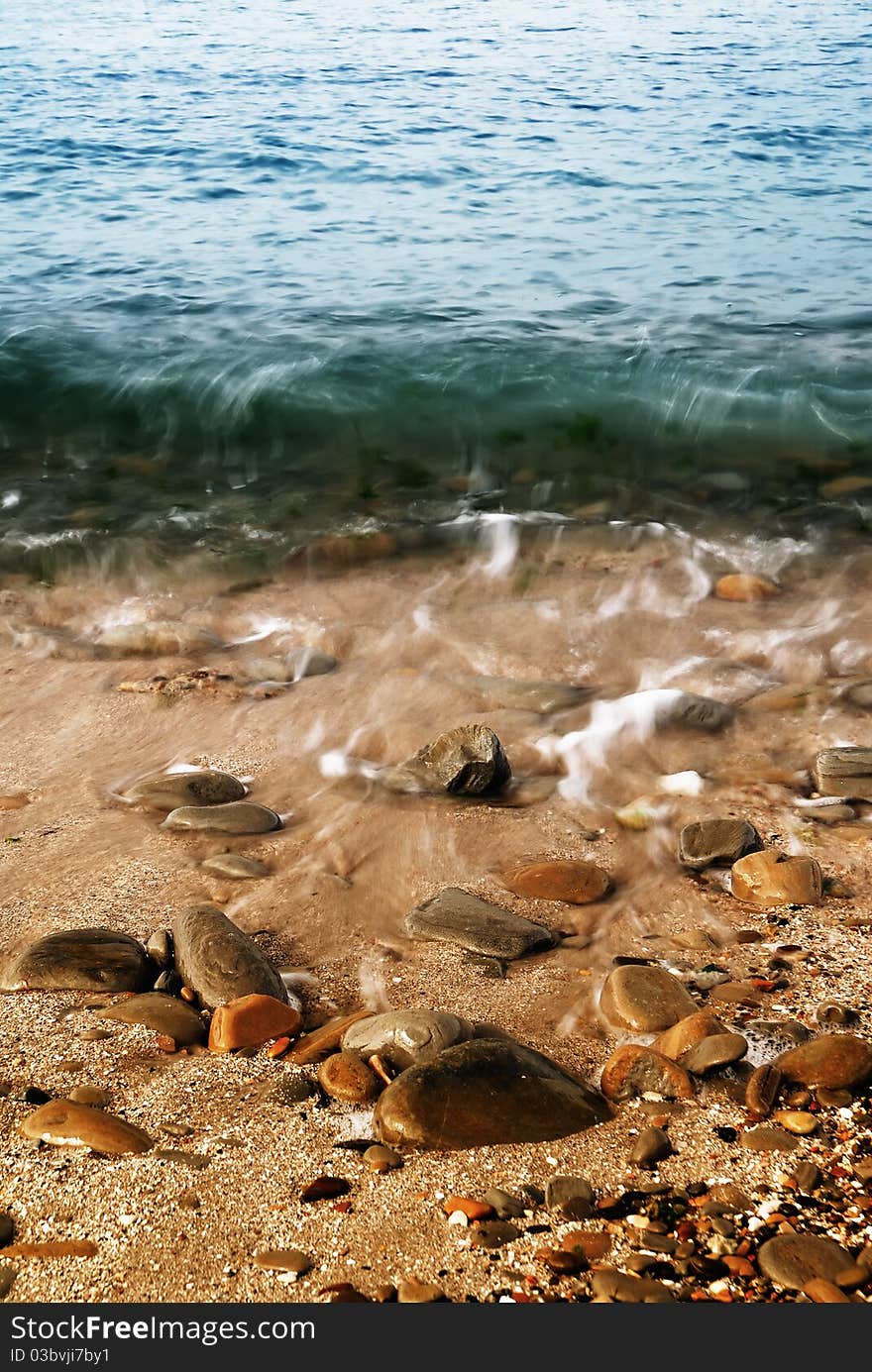 Small wave over the shoreline