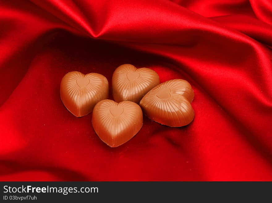 Candy Hearts On Red Satin