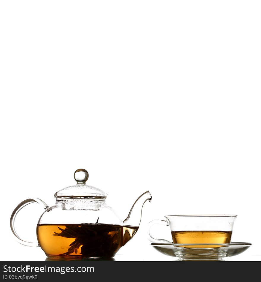 Tea in glass pot isolated