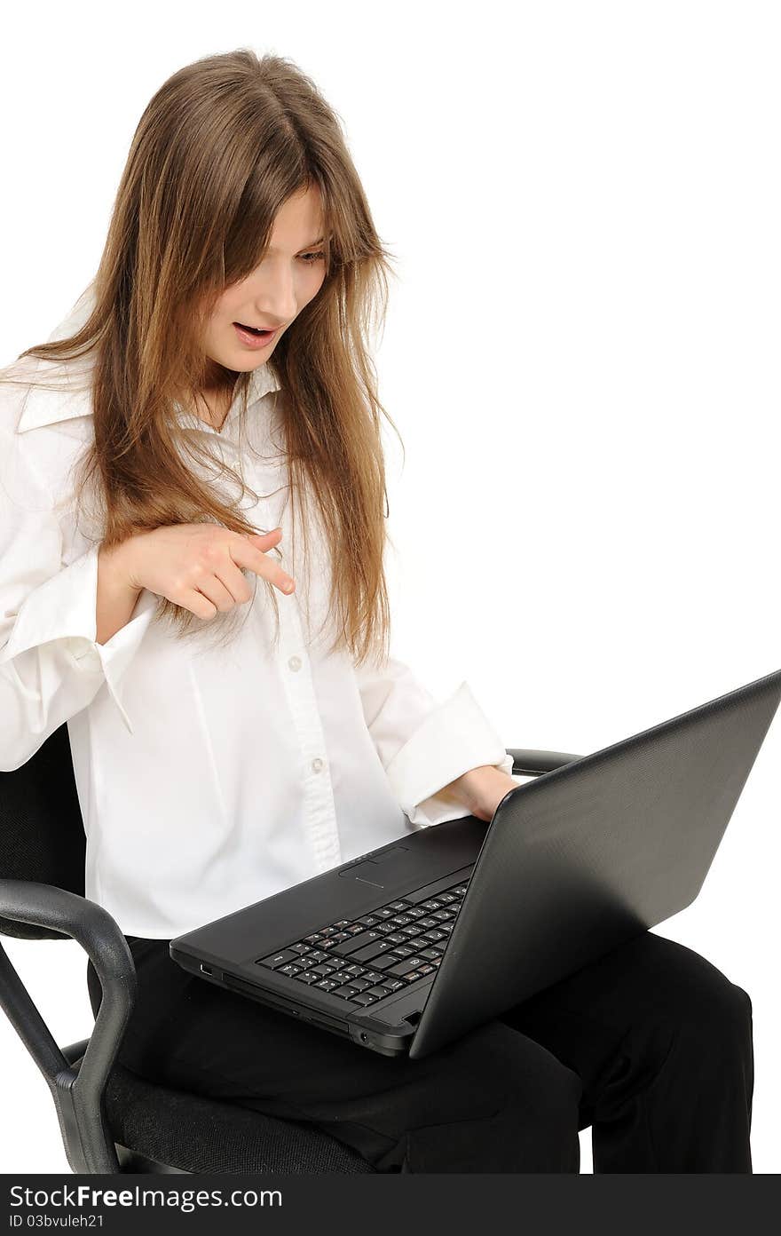 Woman with laptop is surprised on a white background