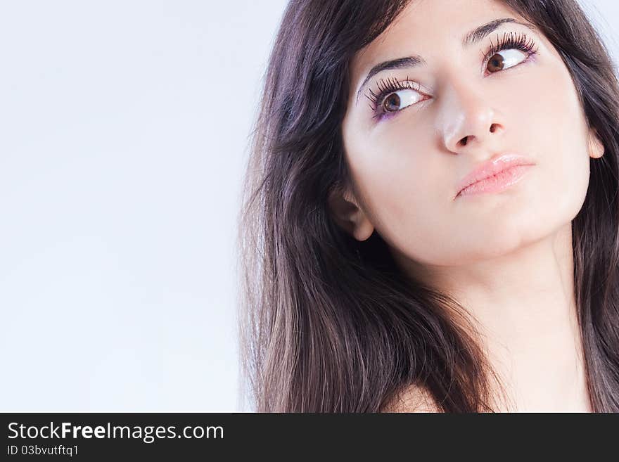 Pretty woman with long brown hair looking at camera, isolated on white background. Pretty woman with long brown hair looking at camera, isolated on white background