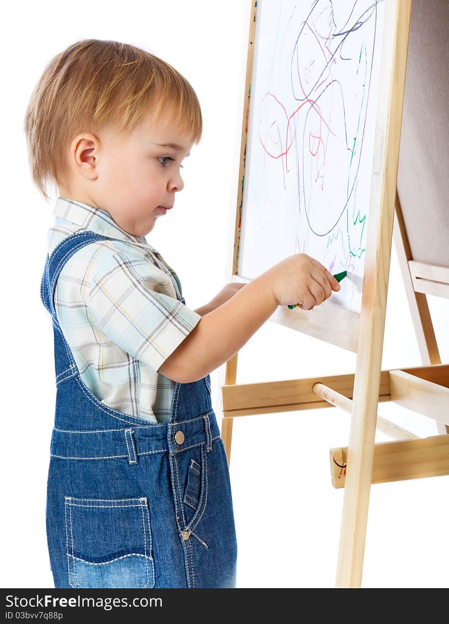 A boy is drawing on a blackboard. Isolated on a white background