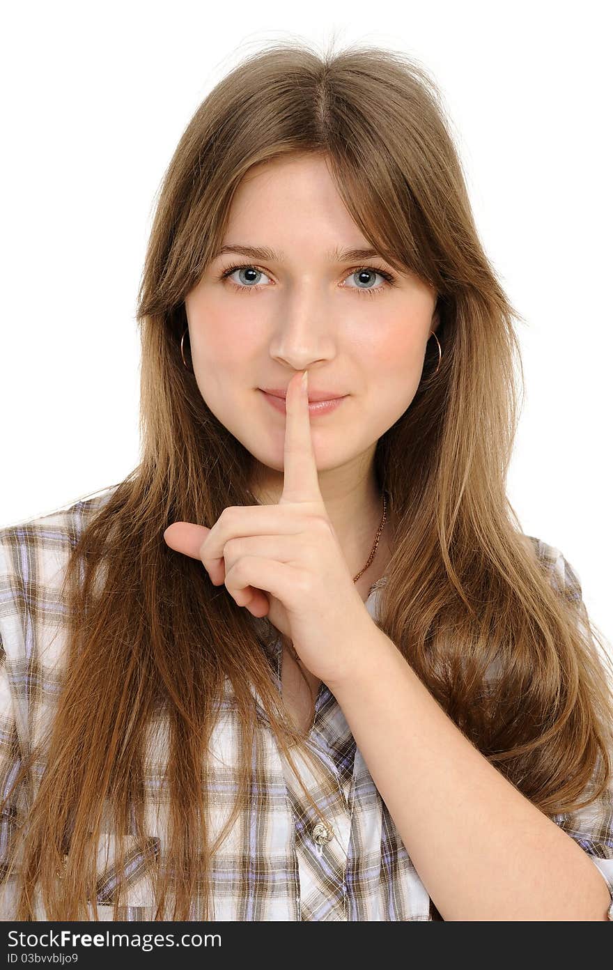 Young woman says ssshhh to maintain silence on a white background