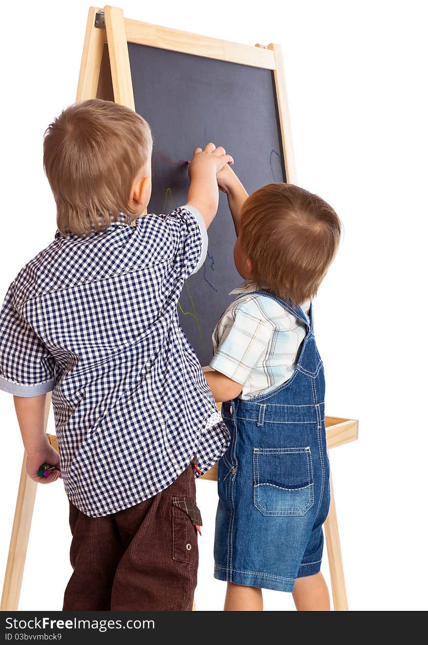 Boys are drawing on a blackboard. Isolated on a white background