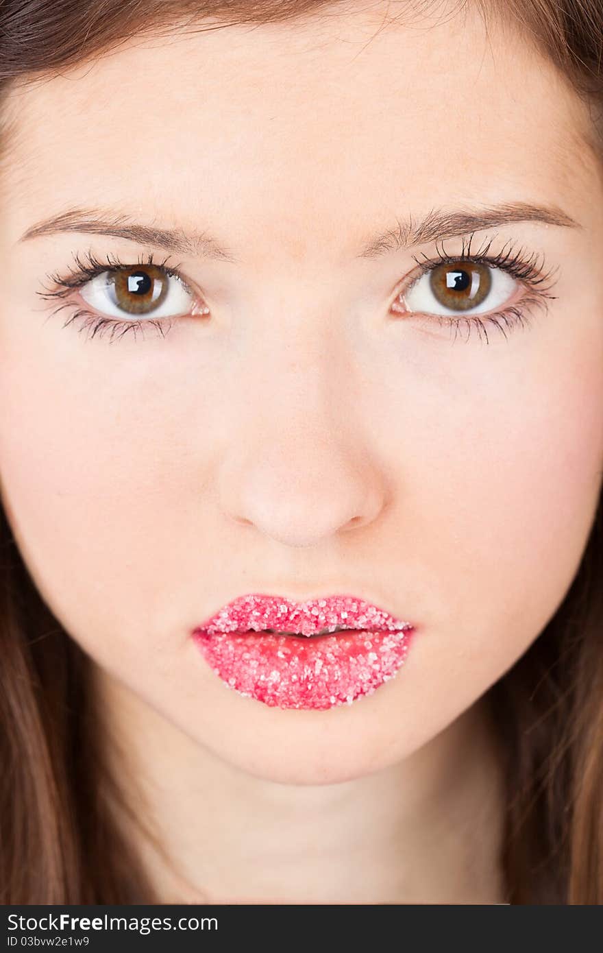 A face of a beautiful girl with sugar lips