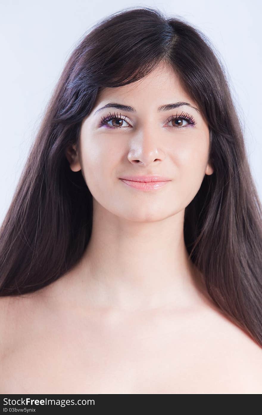 Pretty woman with long brown hair looking at camera, isolated on white background. Pretty woman with long brown hair looking at camera, isolated on white background