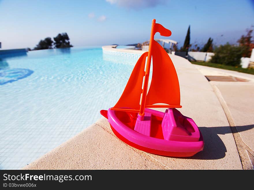 Toy ship in swimming pool. Toy ship in swimming pool