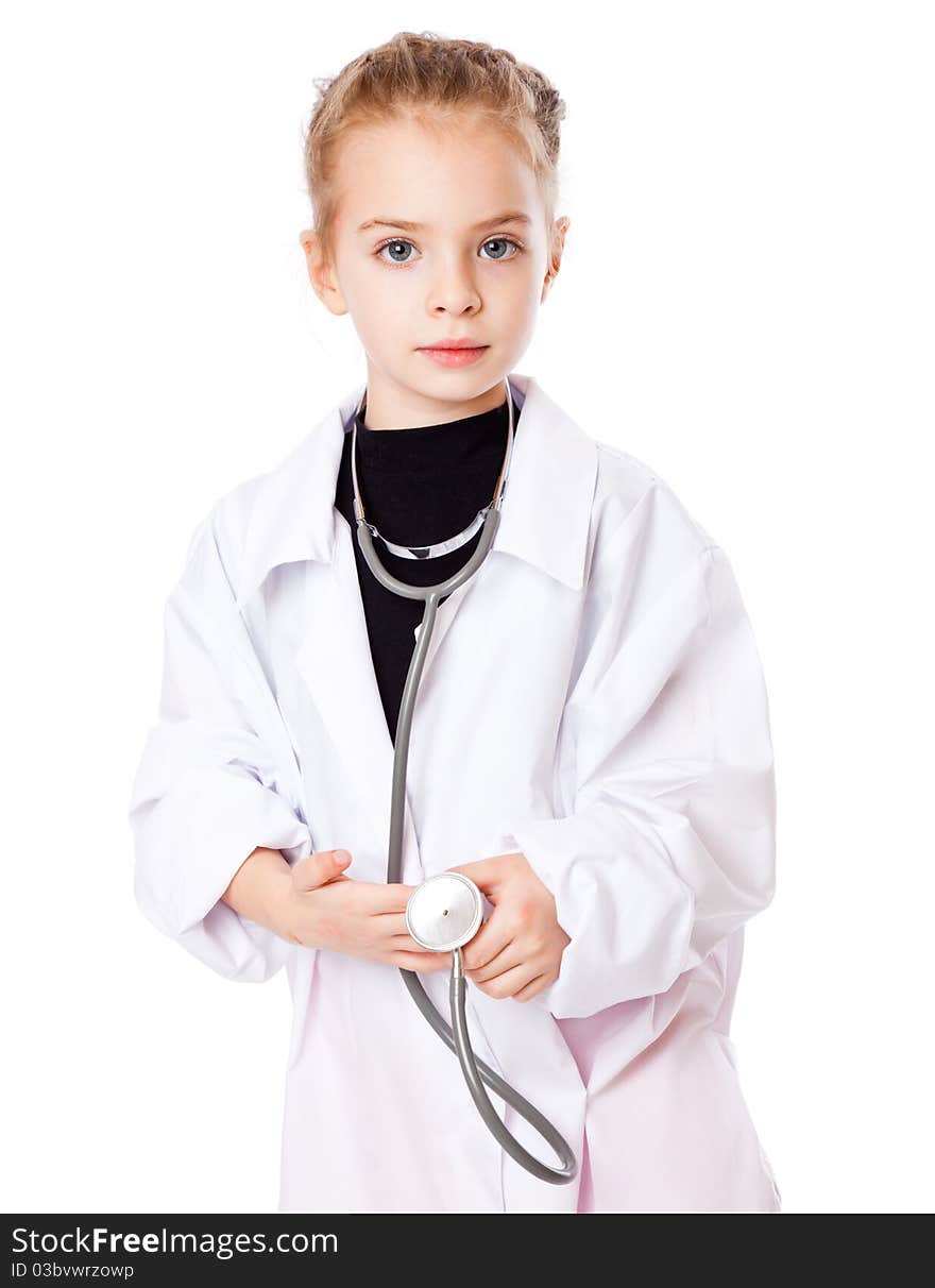 A girl is dressed as doctor. Isolated on a white background