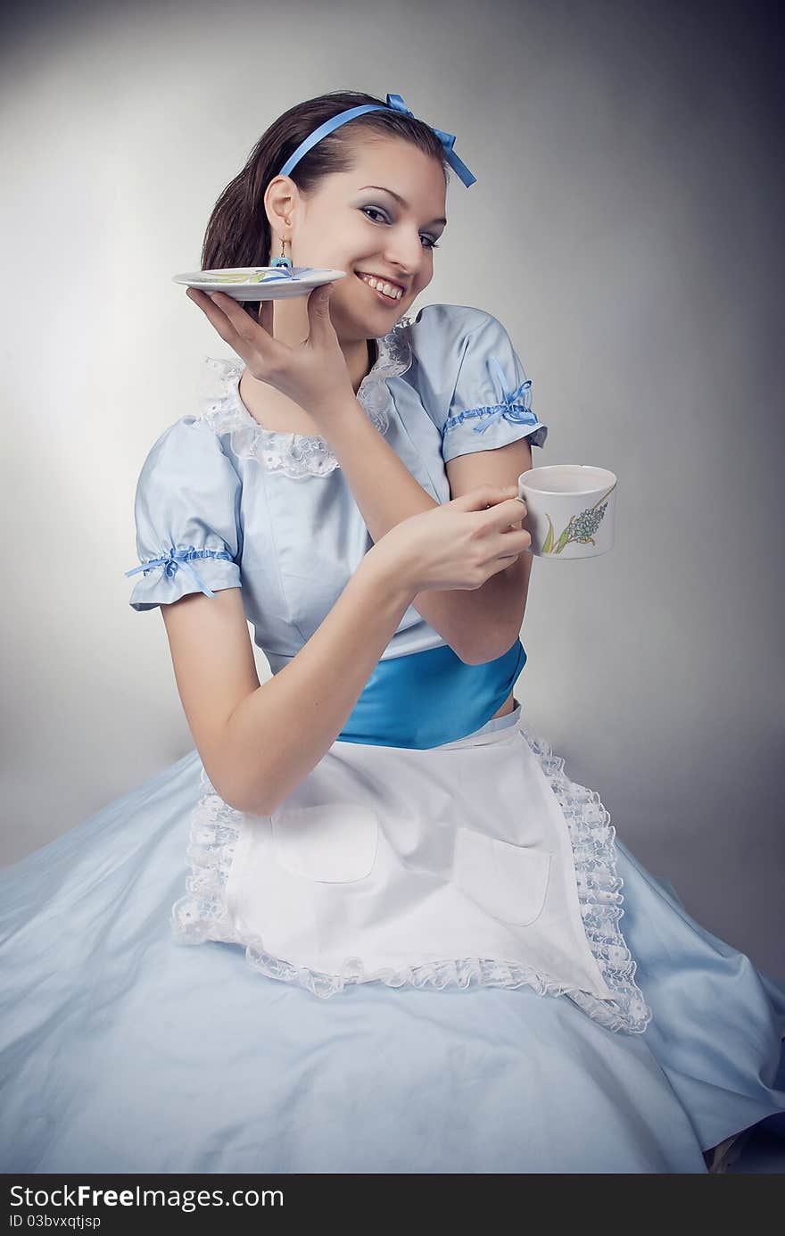 Beautiful girl drinking tea