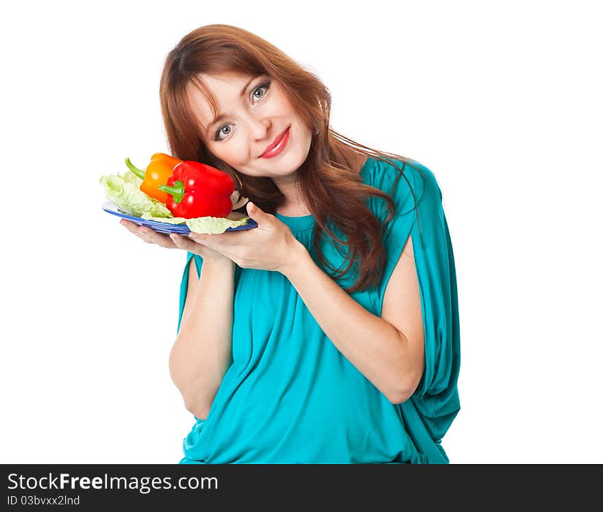 A pregnant woman with a plate of vegetables. isolated on a white background