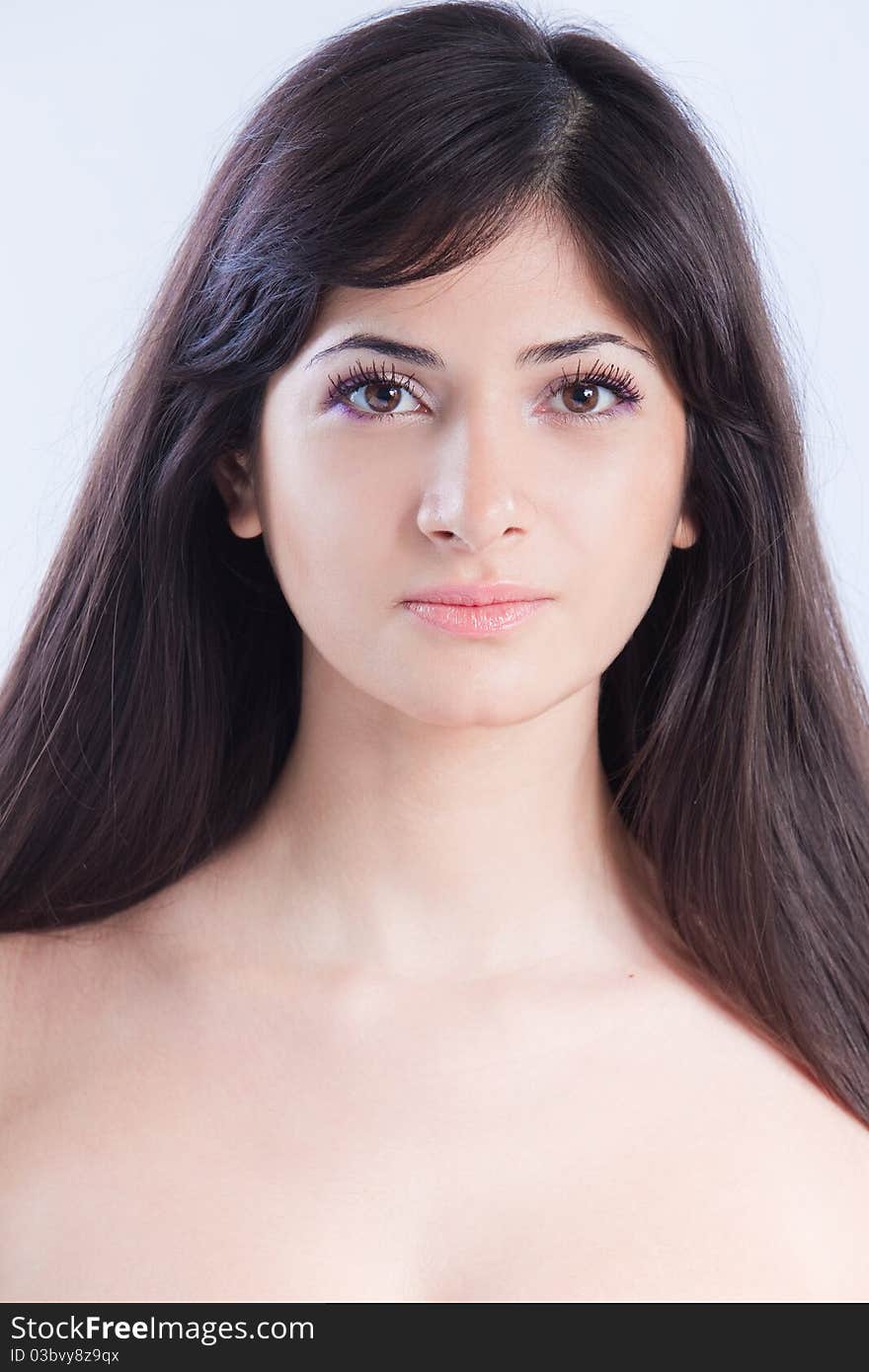 Pretty woman with long brown hair looking at camera, isolated on white background. Pretty woman with long brown hair looking at camera, isolated on white background